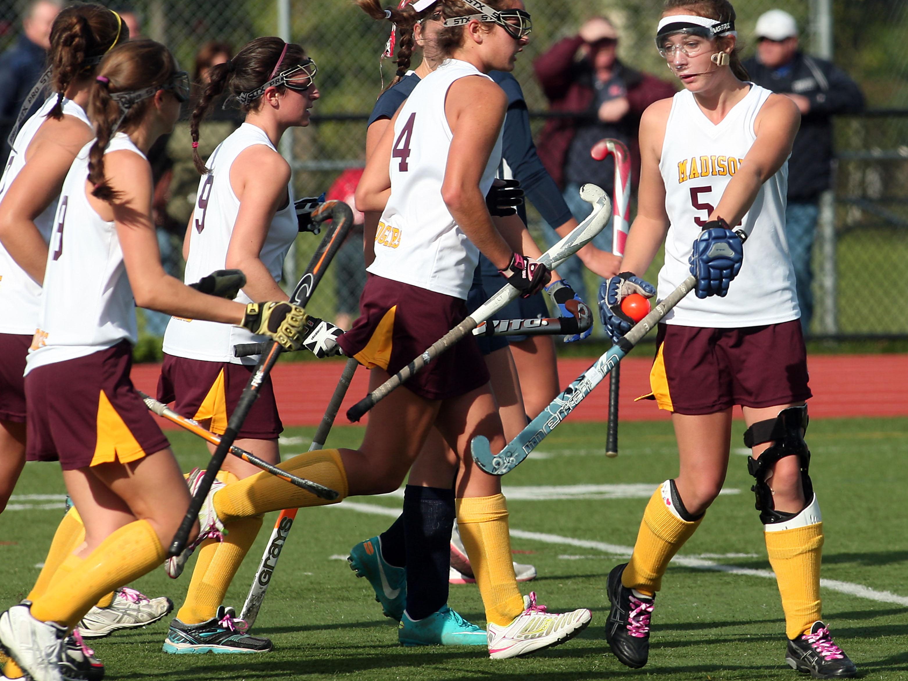 Madison's Caroline Turnbull, r, is congratulated by teammates after scoring in the first half of a Morris County Tournament semifinal.