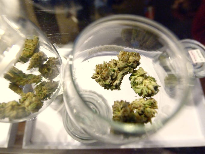 Samples of marijuana sit on the counter at the Denver Discreet Dispensary in Denver. Colorado is the first state to sell recreational marijuana legally after a law went into effect Jan. 1, 2014.