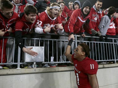 La Salle junior TreSean Smith celebrates with fans at Ohio Stadium after the Lancers' state championship win Dec. 4 in Columbus.