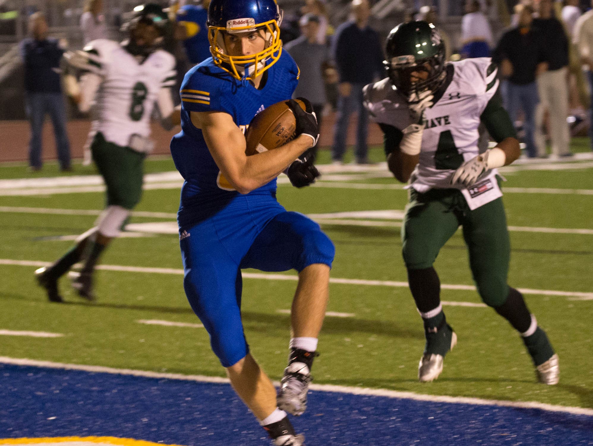 Oxford's Ken Presley lands his second touchdown reception of the night, giving the Chargers a six-point lead Friday at home. Oxford beat West Point 35-7 in the Class-5A North State championship game.