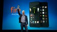 Amazon CEO Jeff Bezos holds up the new Amazon Fire