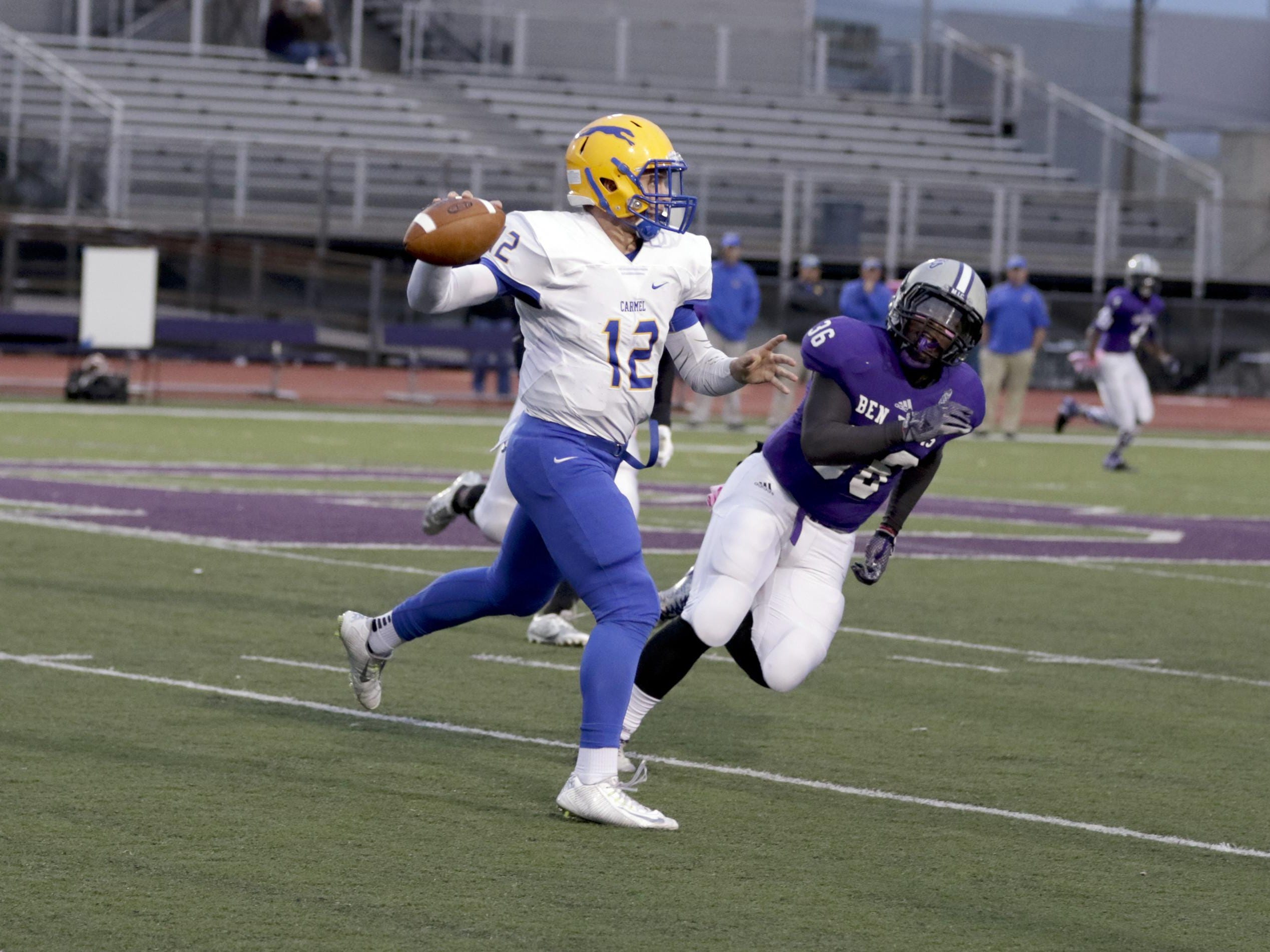 Carmel QB Michael Viktrup looks for a receiver in the Greyhounds’ 35-21 win over Ben Davis on Friday.