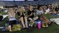Moriah Lutz-Tveite (cq), Leslie O'Connor, Katie White and Carolanne Sanders (cq) cheer for the Commodores as they play against Virginia during a College World Series  watch party at Dudley Field Wednesday June 25, 2014, in Nashville, Tenn.