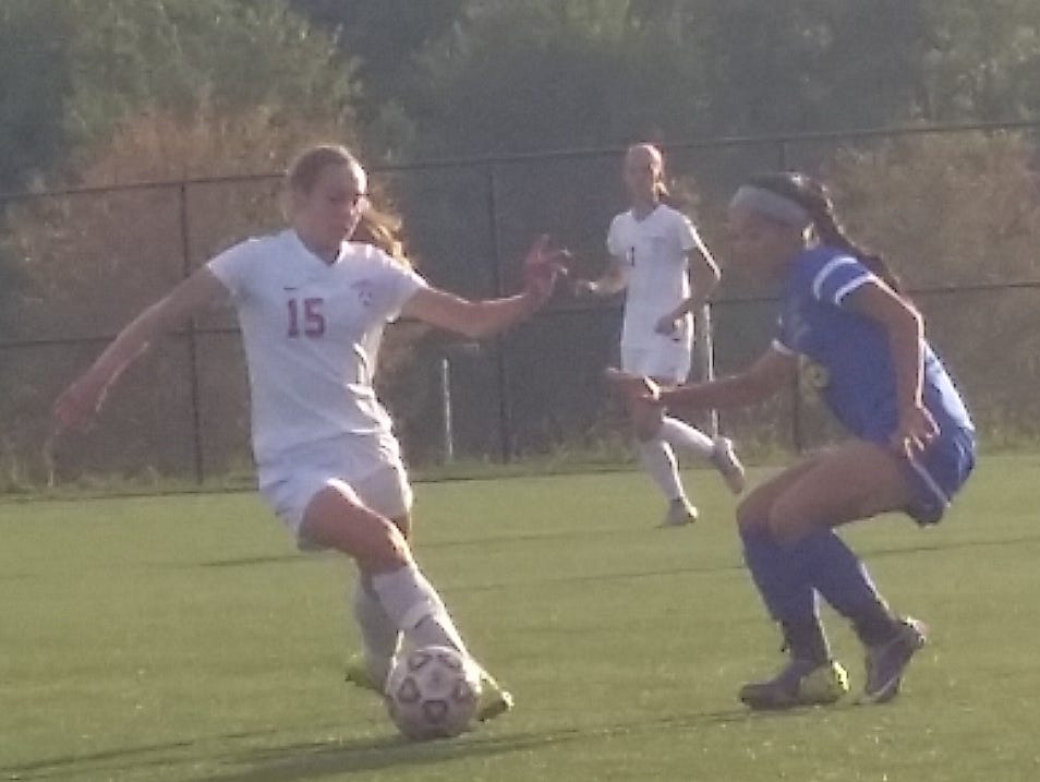 Somers junior defender Mary Murphy attempts to dribble past Mahopac junior forward Kayleigh Miller during the second half of a game at Somers High School on Friday, September 25th, 2015. Somers won 7-0.