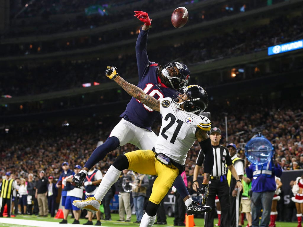 Houston Texans wide receiver DeAndre Hopkins (10) scores a touchdown as Pittsburgh Steelers cornerback Joe Haden (21) defends during the fourth quarter at NRG Stadium.