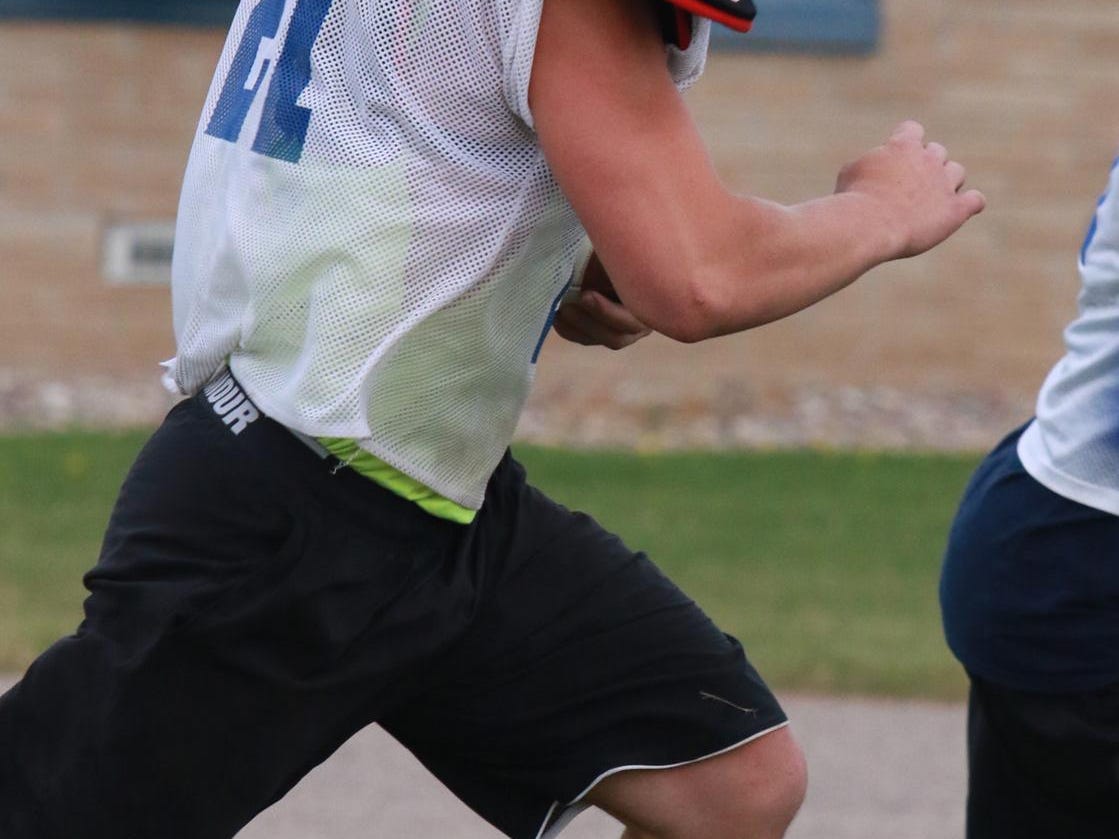 Kurt Jankowski runs with the ball during practice at Auburndale, Friday, August 7, 2015.