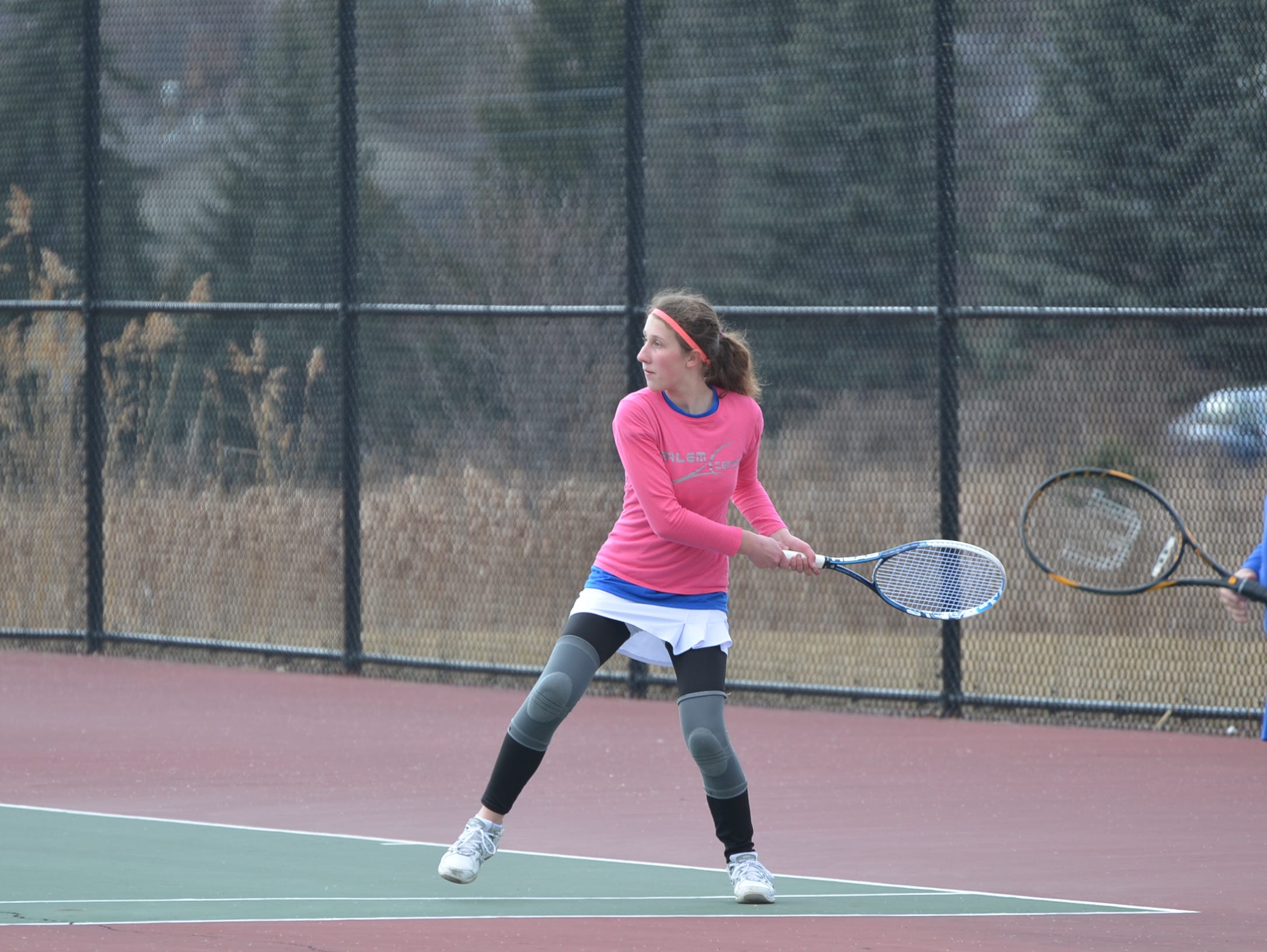 Getting ready to launch a return for Salem is 3 singles player Madison Kulik.