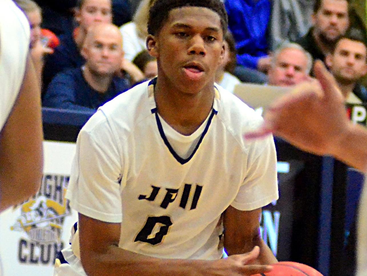 Pope John Paul II High freshman Avishai Lowery dribbles into the lane during third-quarter action.
