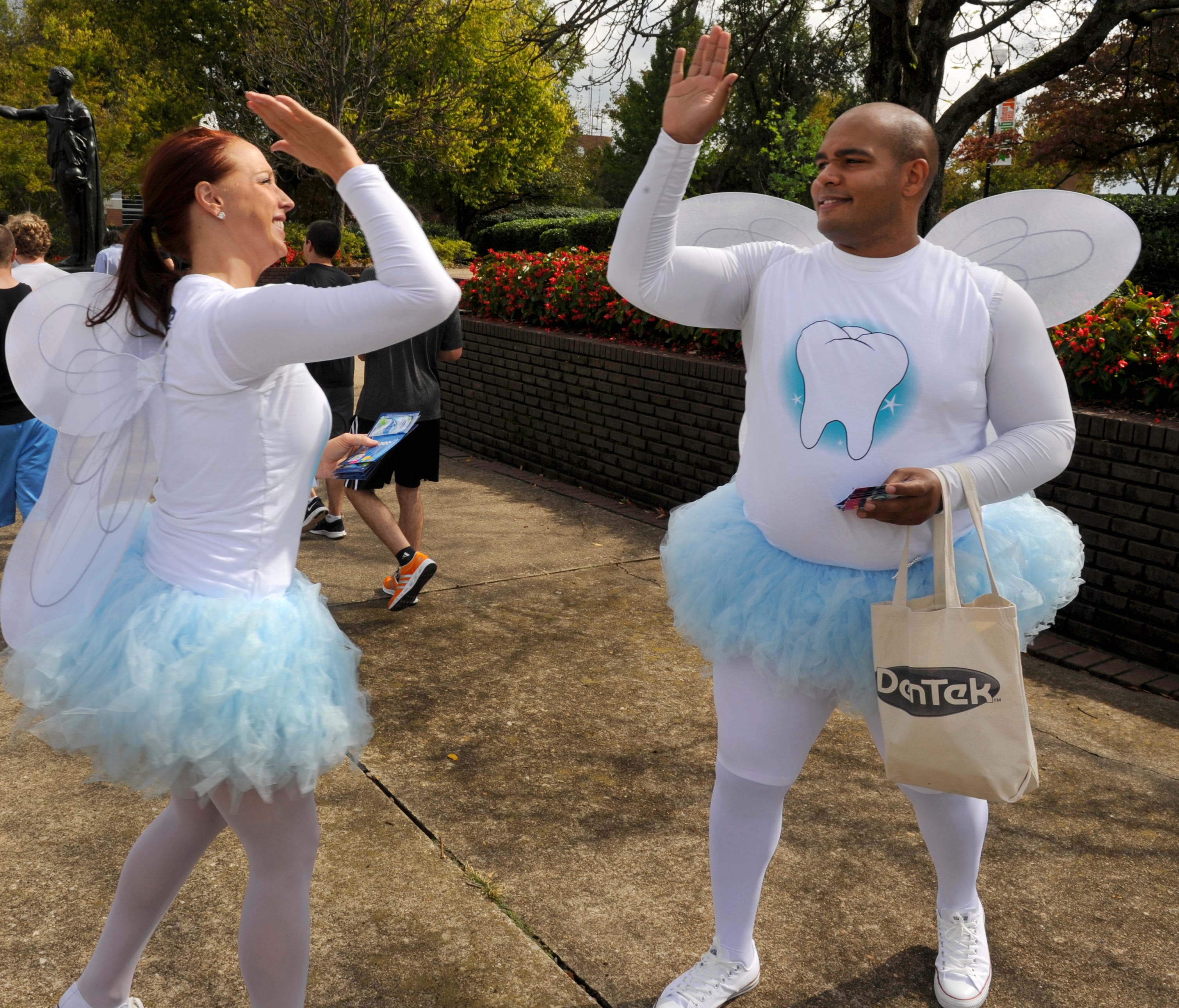 The Tooth Fairy is on a tighter budget this year, on average leaving 24 cents less per tooth than last year, according to a Visa survey out Monday. Tooth fairies Jessica Mitchell, left, and Jamie Vaughn exchange a high-five after handing out dental f