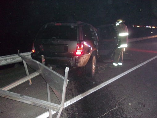 The SUV came to rest in near a guardrail on I-84