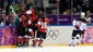 Canada forward Marie-Philip Poulin (29) celebrates with teammates after scoring the tying goal against USA in the third period.