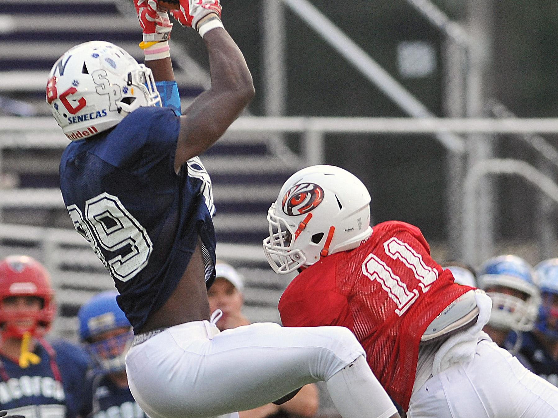 The North’s Tyrell Edmiston comes down with a catch during the Saturday’s All-Star game.
