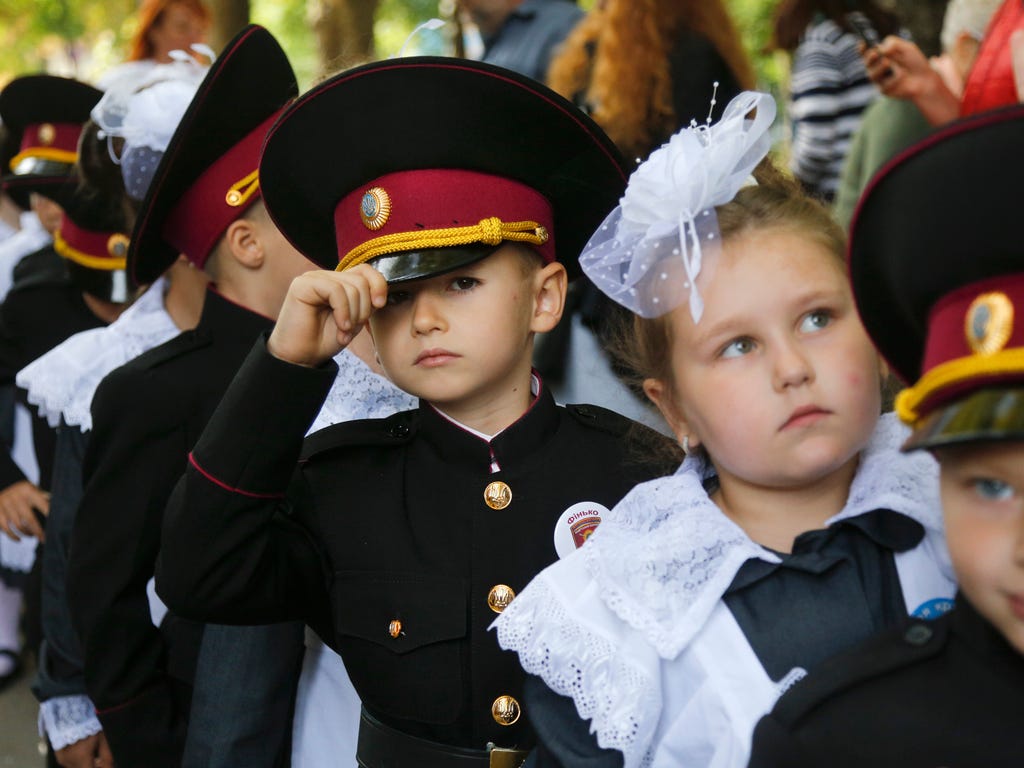 Young cadets and school girls attend a ceremony on the first day of school at a cadet lyceum in Kiev, Ukraine. Ukraine marks Sept. 1 as Knowledge Day, a traditional launch of the academic year.