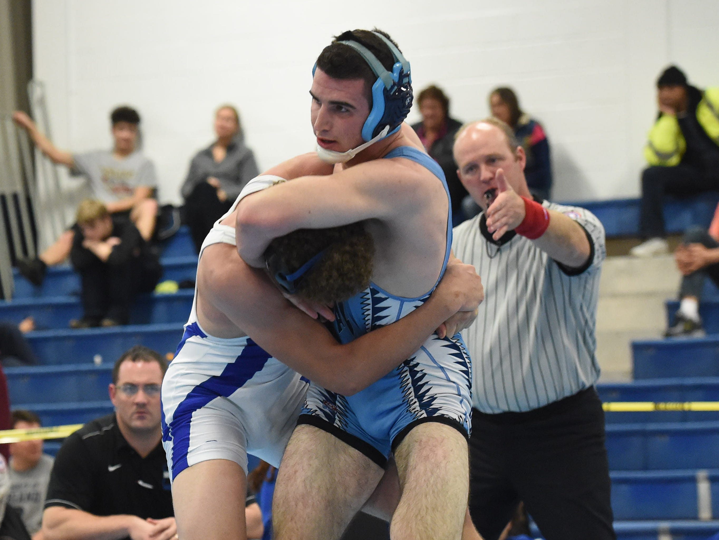 John Jay High School's Eric Wakefield puts Middletown's Adonis Moreno into a hold in a semifinal match during Saturday's Patriot Invitational held at John Jay High School.