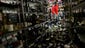 Eddie Villa uses a shovel to clean up wine bottles that fell from the shelves at Van's Liquors after an early morning earthquake in Napa.