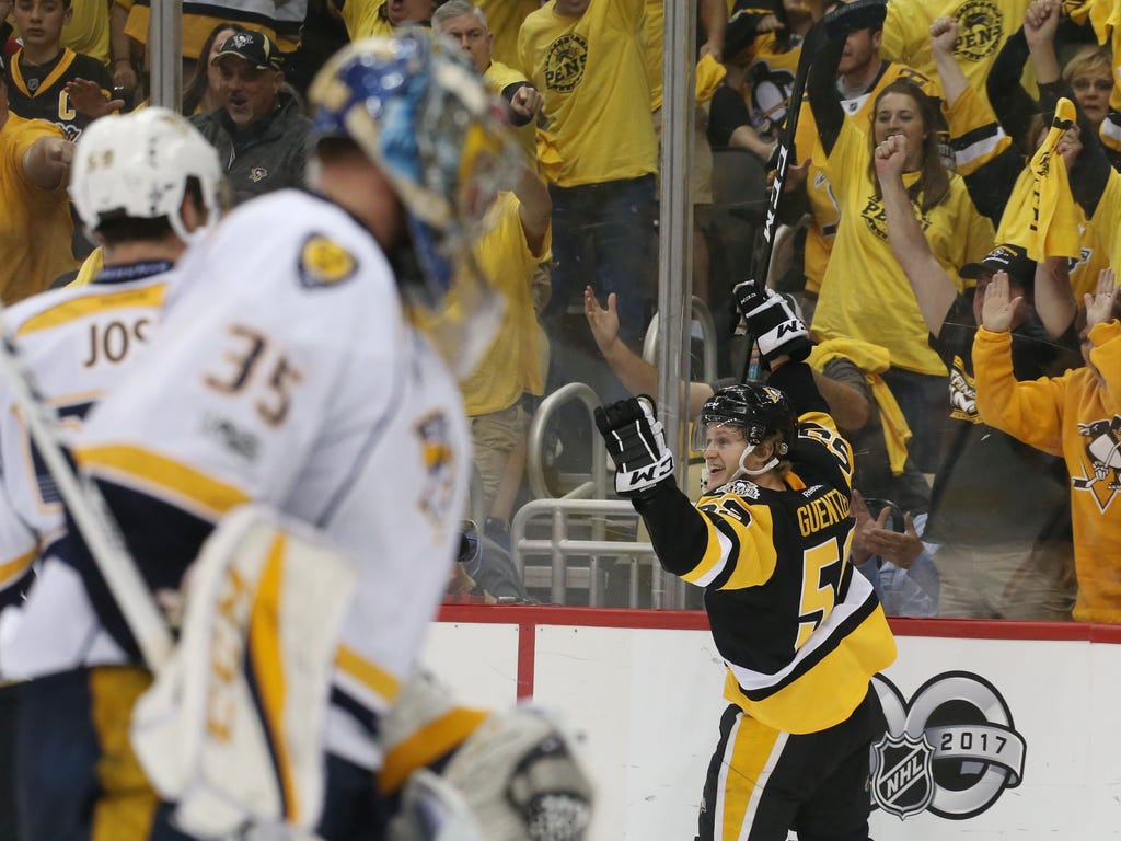 The Pittsburgh Penguins' Jake Guentzel celebrates after scoring the go-ahead goal past Nashville Predators goalie Pekka Rinne in a 5-3 win in Game 1 of the Stanley Cup Final.