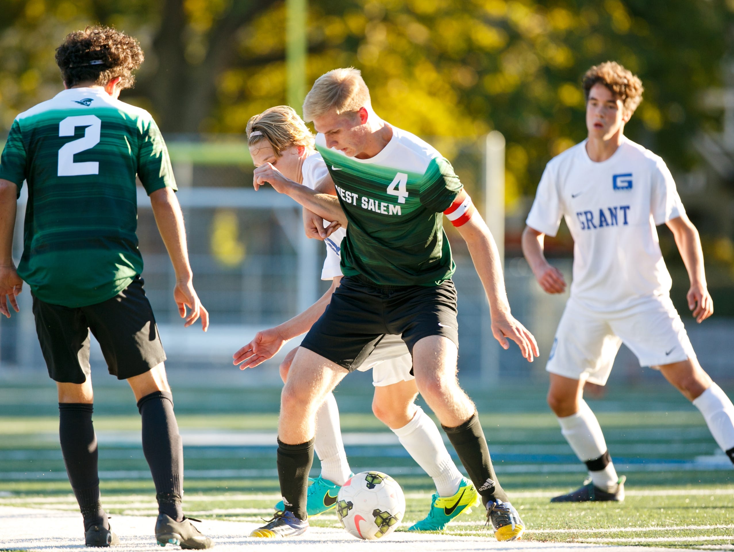 West Salem's Max Shaw (4) fights for control of the ball in a game against Grant High School on Tuesday, Sept. 13, 2016, in Portland, Ore. The West Salem Titans tied 1-1 with Grant.