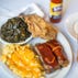 Guests can try "Sylvia's World-Famous Talked About Bar-B-Que Ribs" with original Sassy Sauce, fried chicken, collard greens and baked macaroni & cheese as a combo.