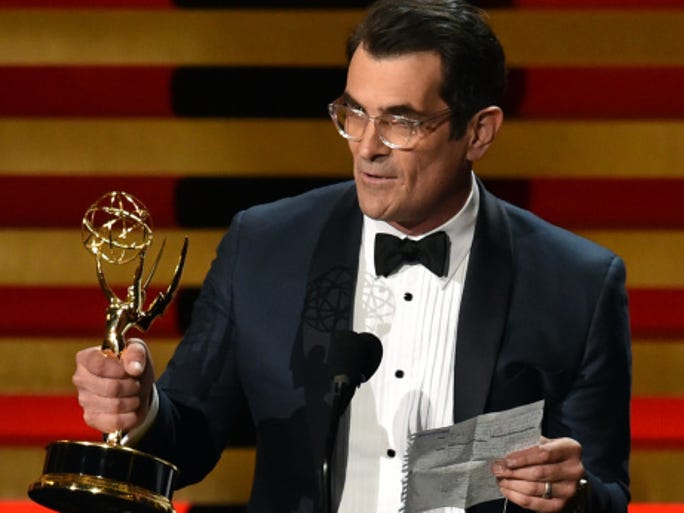 LOS ANGELES, CA - AUGUST 25: Actor Ty Burrell accepts Outstanding Supporting Actor in a Comedy Series for 'Modern Family' onstage at the 66th Annual Primetime Emmy Awards held at Nokia Theatre L.A. Live on August 25, 2014 in Los Angeles, California. (Photo by Kevin Winter/Getty Images)