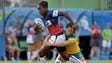 USA back Victoria Folayan tries to break a tackle by