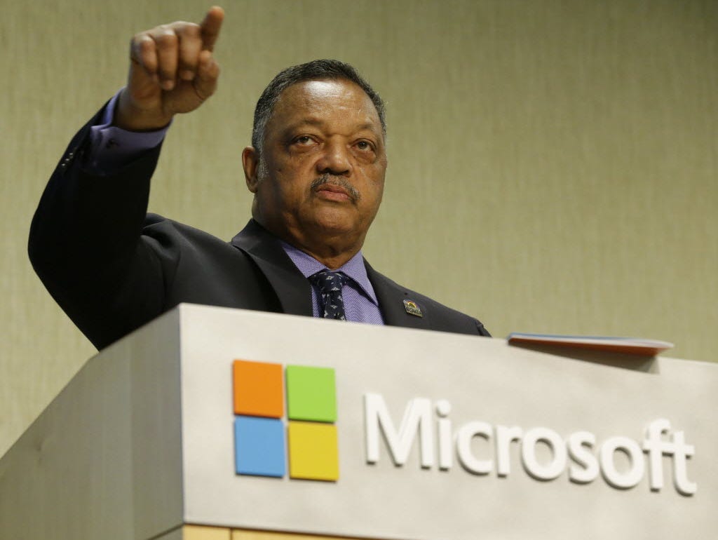 Jesse Jackson addresses Microsoft executives, one of many such meetings in recent months as his Rainbow/PUSH coalition tackles the issue of diversity hiring in Silicon Valley.