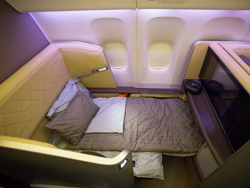 first-class seat in the first Singapore Airlines Boeing 777-300ER to be configured with its all-new interior. This seat reclines into a full-flat bed for sleeping.
