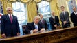 Trump signs executive actions in the Oval Office on
