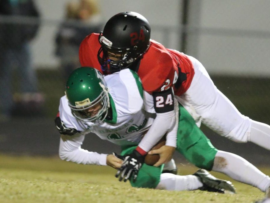 Hillcrest's Raymond Griffen (24) takes down Easley's Dalton Black (11) for a loss.