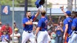 Sept. 28: Tim Tebow, greeted by his teammates, hit