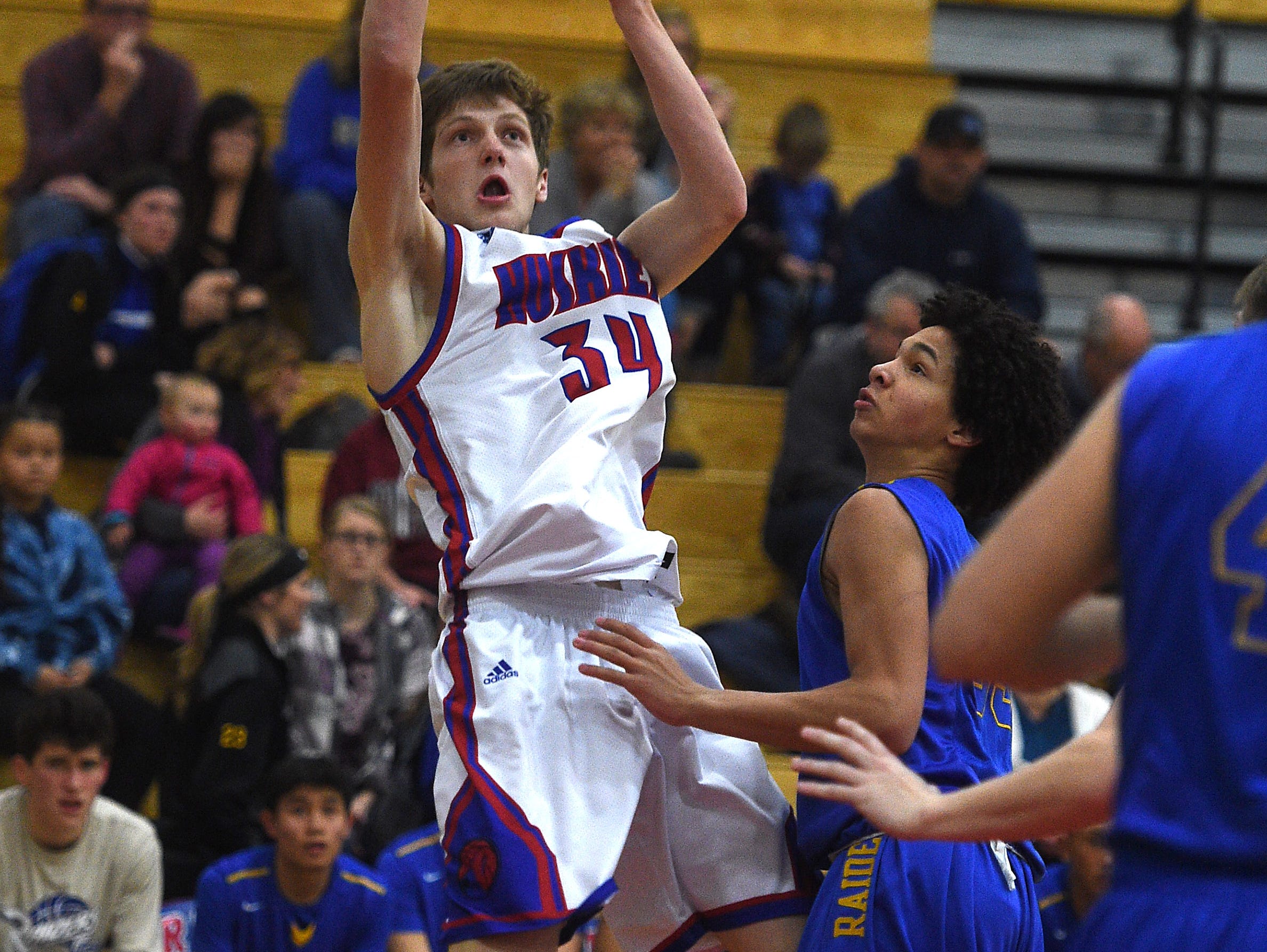 Reno's Tommy Challis (34) shoots while taking on Reed during their basketball game in Reno on Friday.