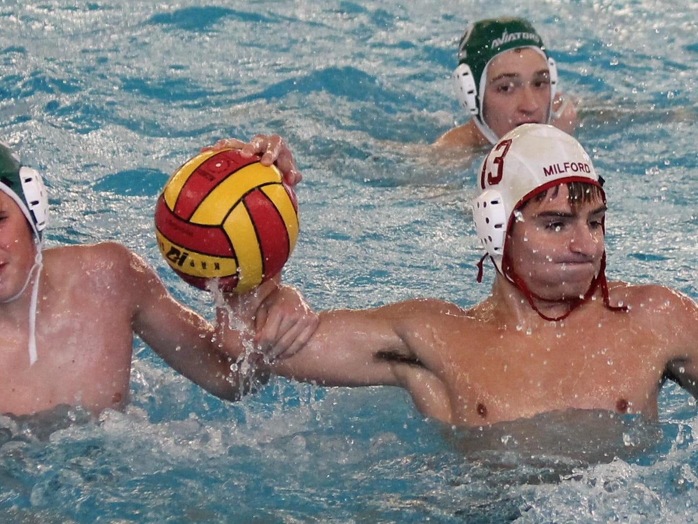 Josh Weaver struggles to get a shot off with a defender hanging on his arm.