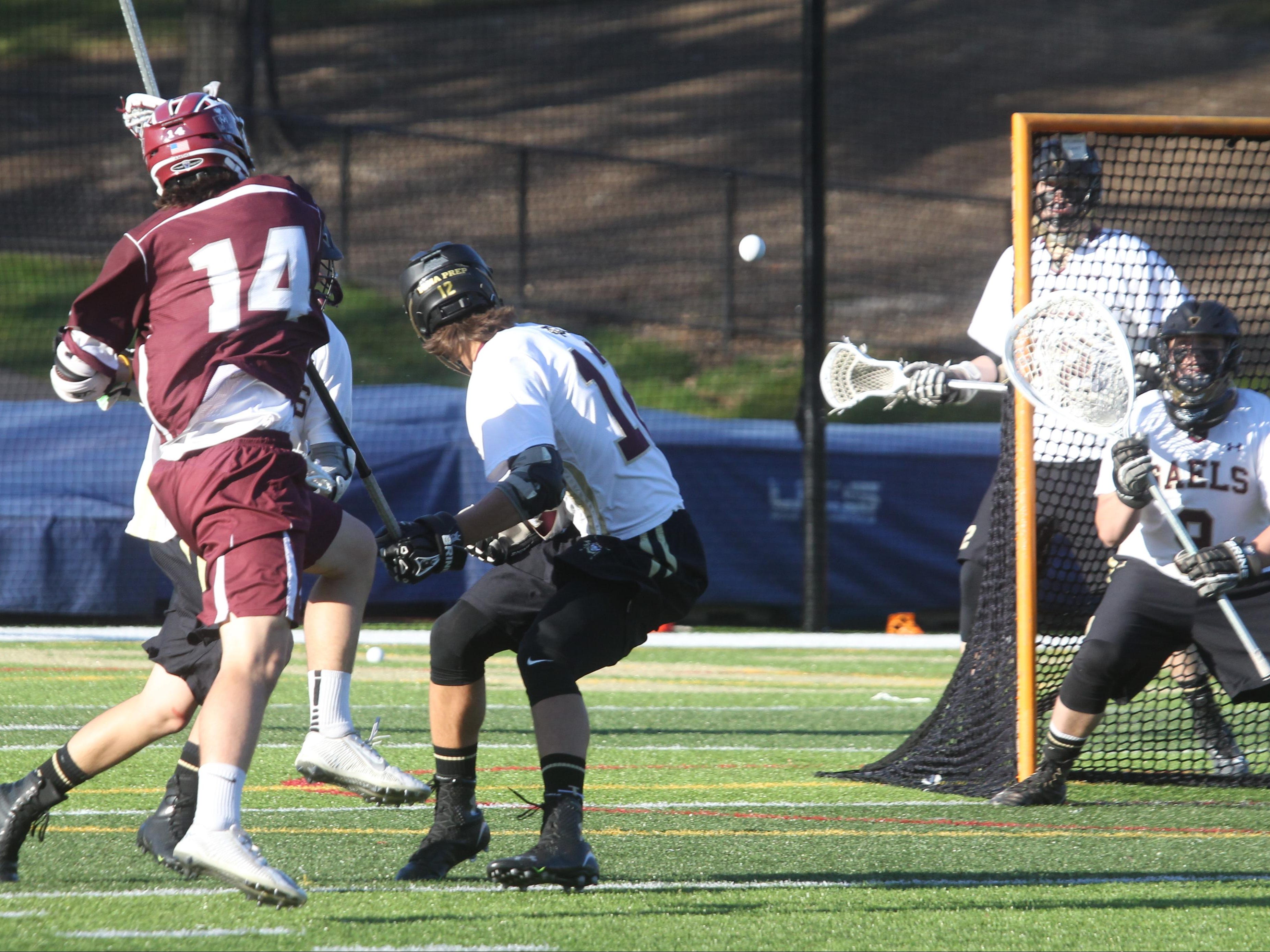 Fordham Prep's Colin Trimble scores past Iona Prep goalie Charlie Allister during their game at Iona Prep April 15, 2016. Fordham Prep won 8-7.