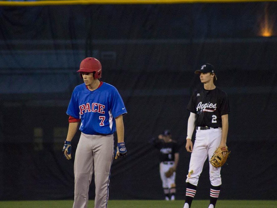 Chase Beckstrom leads off second base while Tate SS Branden Fryman watches.