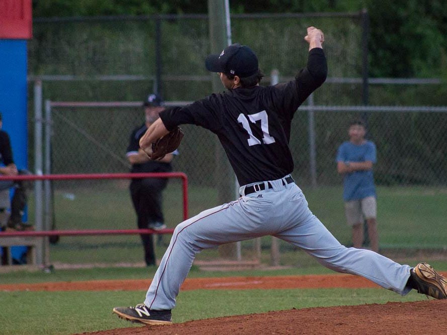 Tate starter Madison Lockman delivers a pitch during the district championshp vs. Pace.