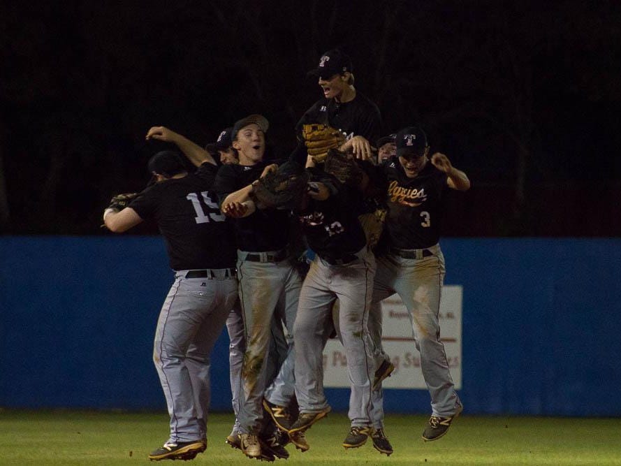 The Tate Aggies celebrate after ca1-7A title with a 3-1 win over Pace.