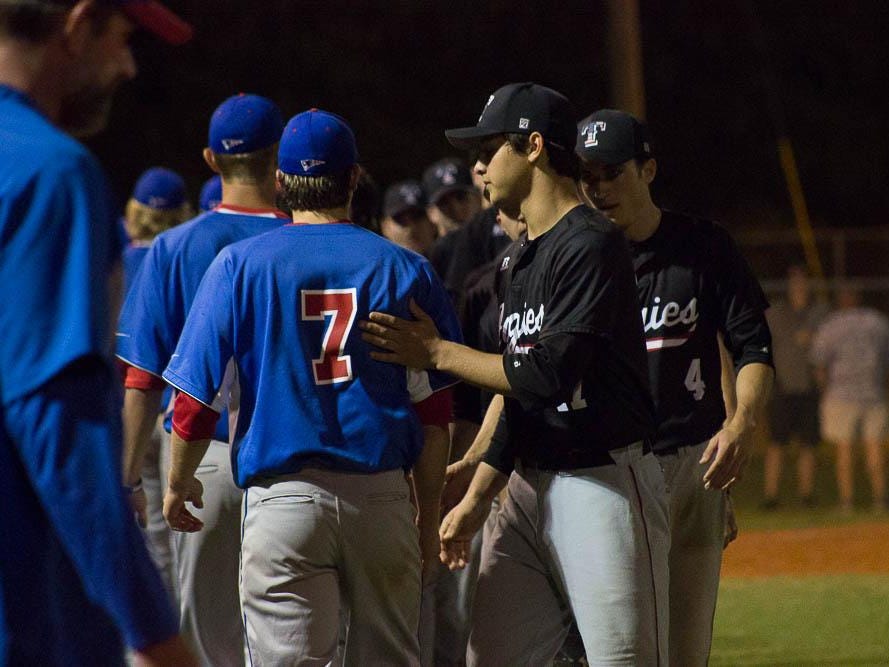 The Tate Aggies and Pace Patriots shake hands following a thrilling district championshp game.