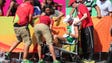 Sandor Racz of Hungary is helped after collapsing during