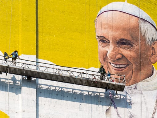 Painters of the "Welcome Pope Francis" mural in New