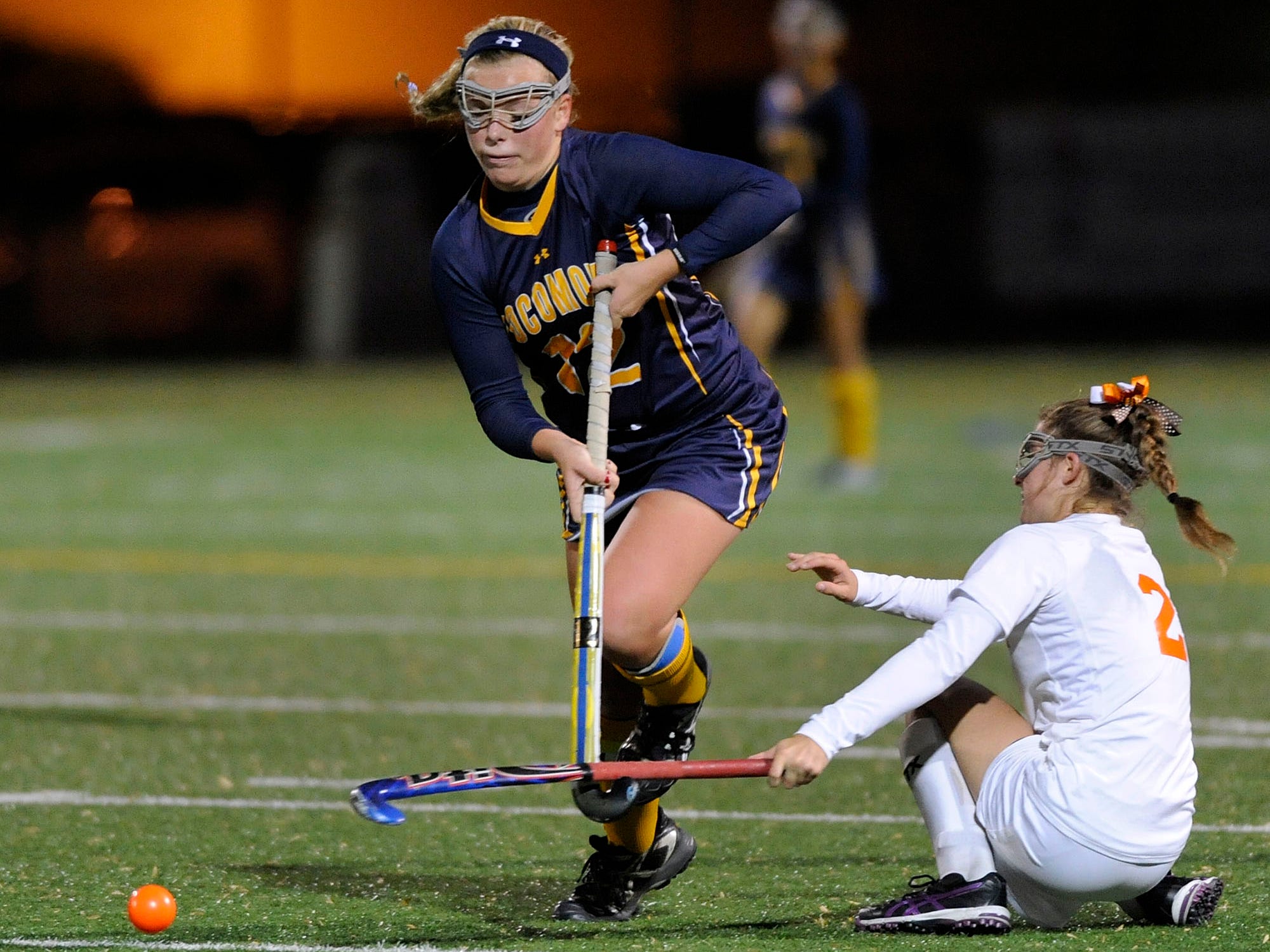 Pocomoke's Lexi Butler, left, moves past Fallston's Kylie Ryan in the second half of a state semifinal field hockey game Monday, Nov. 3, 2014 in Annapolis. (Photo by Steve Ruark for The Daily Times)