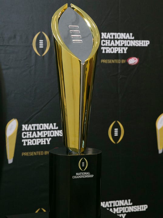 1405452111000-USP-NCAA-FOOTBALL-NATIONAL-CHAMPIONSHIP-TROPHY-UN-65838024.JPG