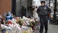 A New York City police officer looks over a makeshift