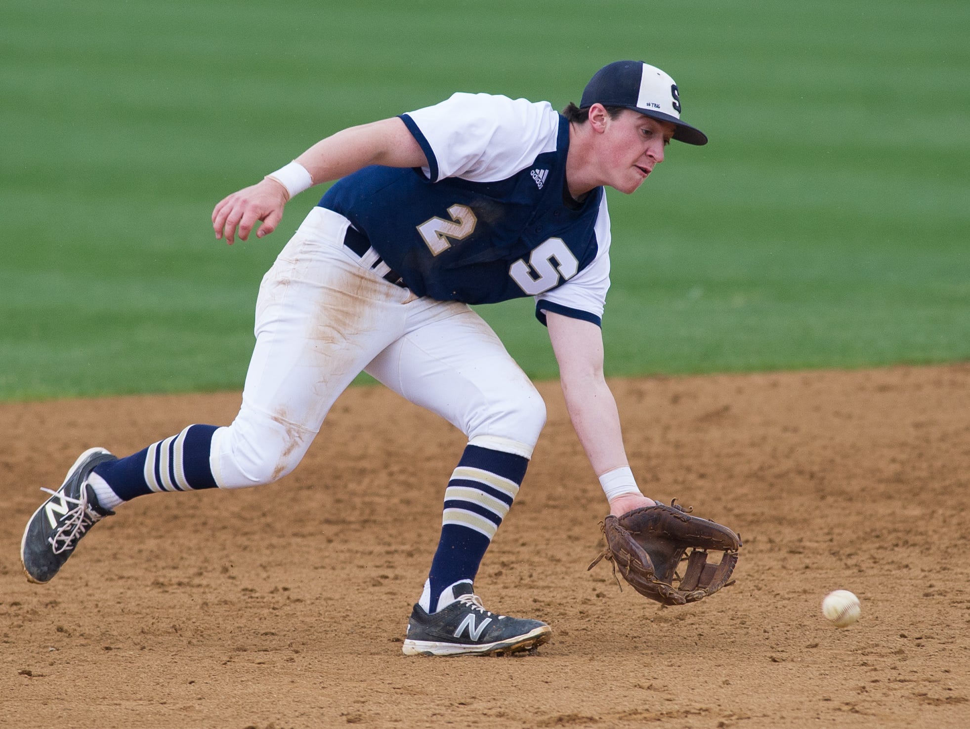 Salesianum's John Andreoli (2) make a grab on a ground ball in their game against Cape Henlopen.