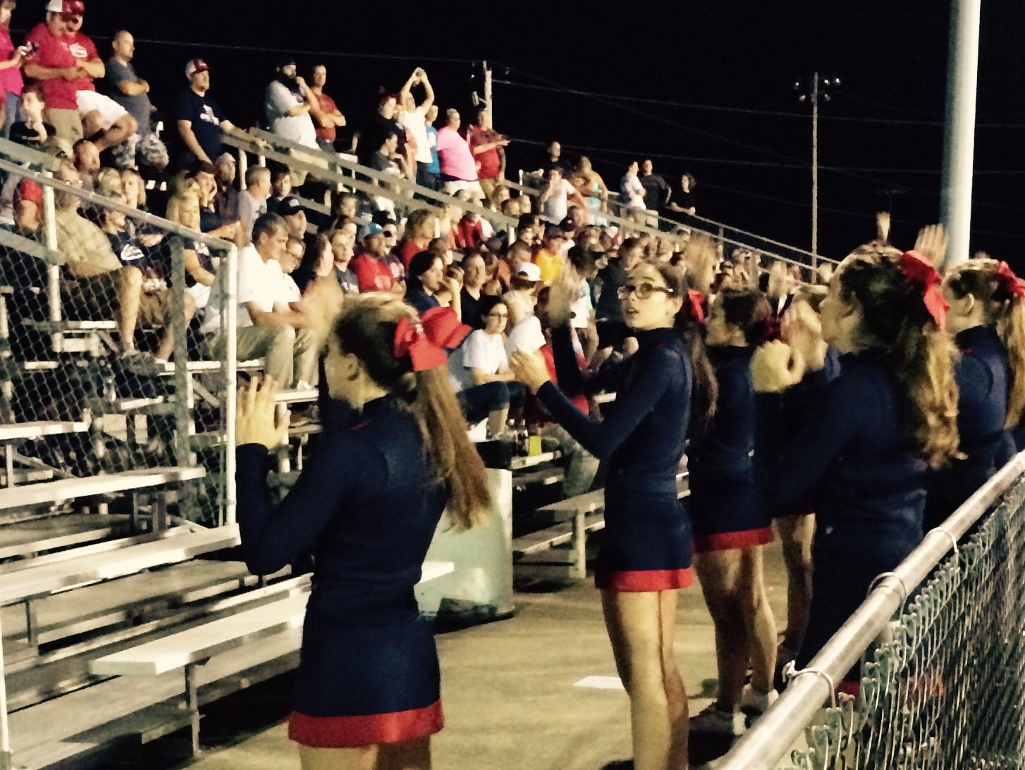 The Creek Wood cheerleaders get the Red Hawks fans off their seats.