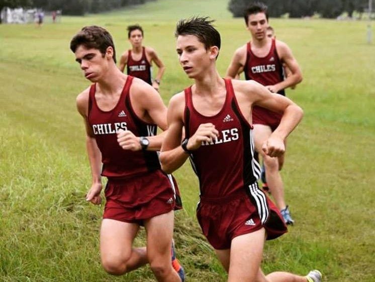 Chiles senior Austin Dodson (right) and sophomore Michael Phillips (left) tackle an early-season cross country race. The pair went 2-3 last week at the Florida Horse Park Invitational, leading the Timberwolves to a dominating team win.