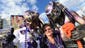 Tonya McCormick of Towson, Maryland, poses for a portrait with fellow Baltimore Ravens fans prior to the game against the Denver Broncos outside of Sports Authority Field at Mile High.