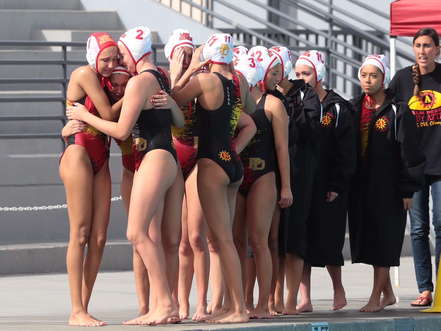 Palm Desert’s water polo team reacts to their 8-7 loss to Los Altos in the CIF Division 5 finals in Irvine on Saturday.