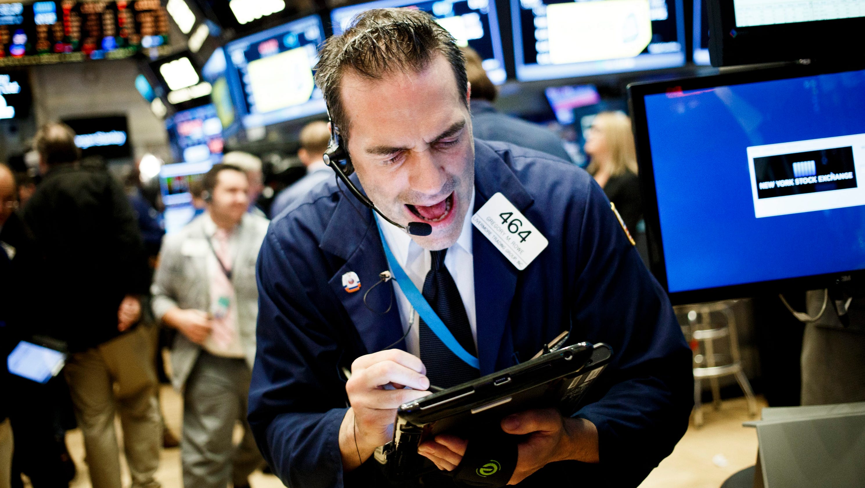 Stocks rally as Fed holds rates steady, Nasdaq closes at record high