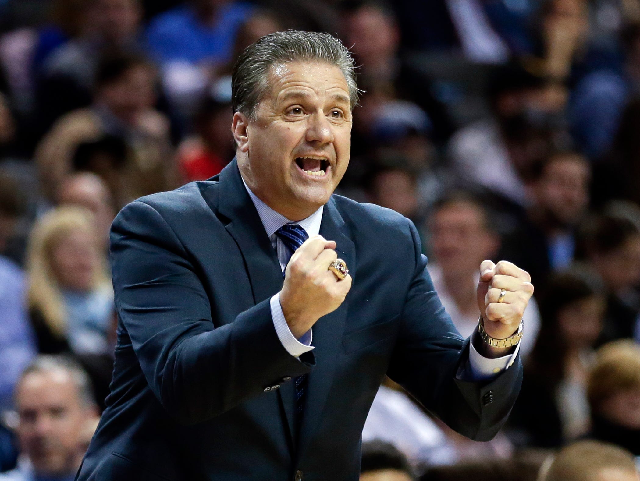 Kentucky head coach John Calipari calls out to his team during the first half of an NCAA college basketball game against Ohio State Saturday, Dec. 19, 2015, in New York. (AP Photo/Frank Franklin II)