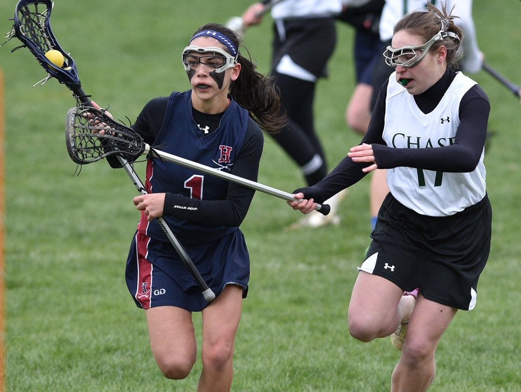 Harvey's Julia Mallon (left) controls the ball during a game against Chase Collegiate on Wednesday, April 6th, 2016.