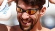 Olympic gold medalist Michael Phelps puts on his goggles